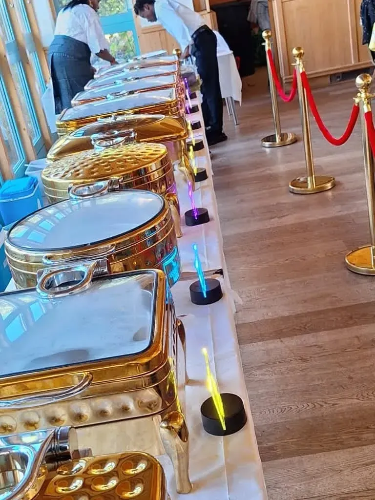 A long line of gold chafing dishes