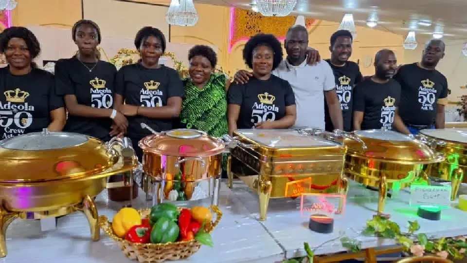 The Anny team behind a gold buffet at a 50th birthday